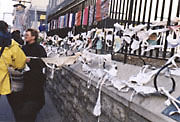 Women protesters used brassieres to decorate the massive chain-link fence around the site of the leaders’ summit. 