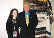 Artist Jennifer Willet met Bill Clinton at the APEC summit in Brunei. Behind them is her work, Untitled (Hudson's Bay Blanket)
