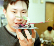 Jeffrey Yong inspects his robotic solar car.