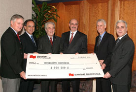 Photo of group holding big cheque