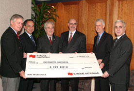 Group holding large cheque