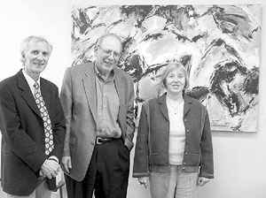 In the photo are, from left to right, Luc Varin, chair of the Biology Department; Martin Singer, Provost & Vice-President Academic Affairs, and Liliane Clement-Ibrahim in front of one of her paintings. They will all be installed in the Renaud Science Complex. 