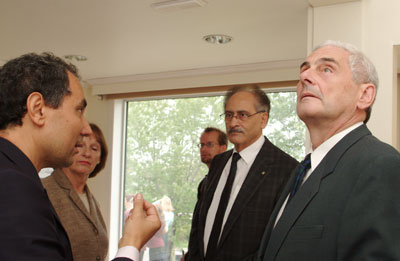  President Claude Lajeunesse, who is himself an engineer, toured Northern Light, the only Canadian entry in the Solar Decathalon, at an open house on Sept. 16. In the photo,, engineering professor Andreas Athienitis (at left) explains the principles behind the construction while Monique Boileau, urban planner of Société d’habitation du Québec (second from left) and Dean of Engineering and Computer Science Nabil Esmail (second from right) look on.√The model is now in Washington, D.C., for judging. Once the competition is over, Northern Light will return to the Loyola campus where it will be used as a teaching facility to demonstrate the potential for solar energy.  Photo: Kate Hutchinson      